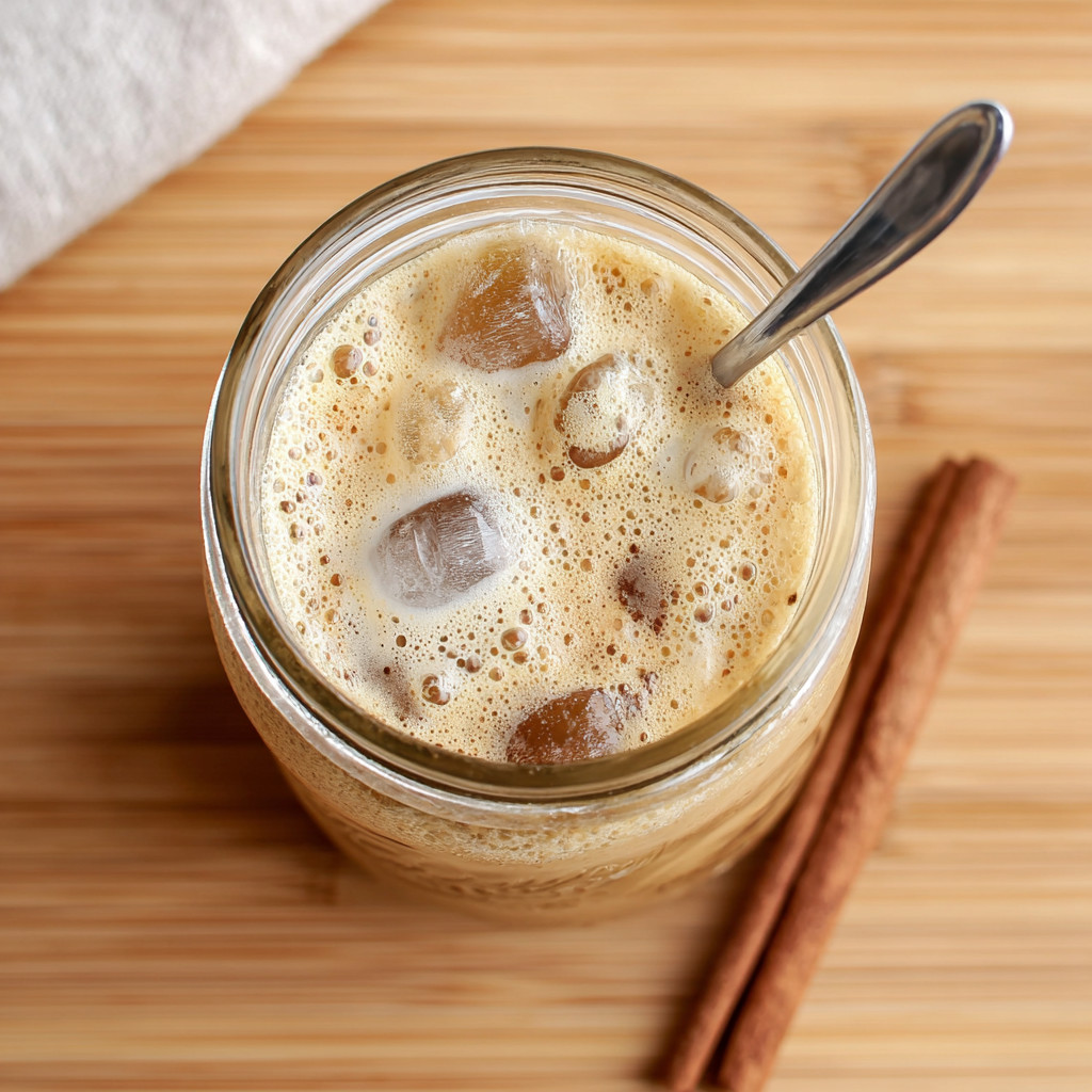 A glass of brown sugar oat milk shaken espresso.