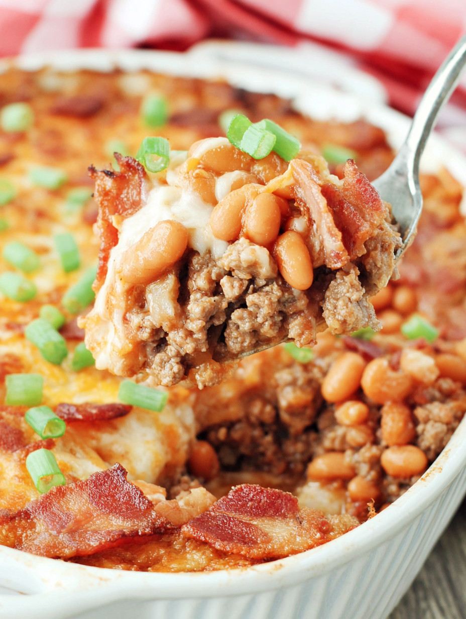 A fork is being used to eat a casserole.