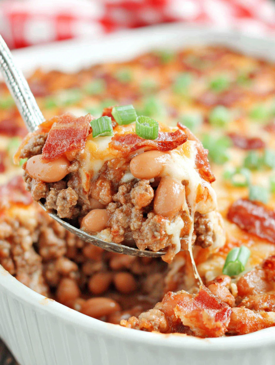 A spoon is in a bowl of food.