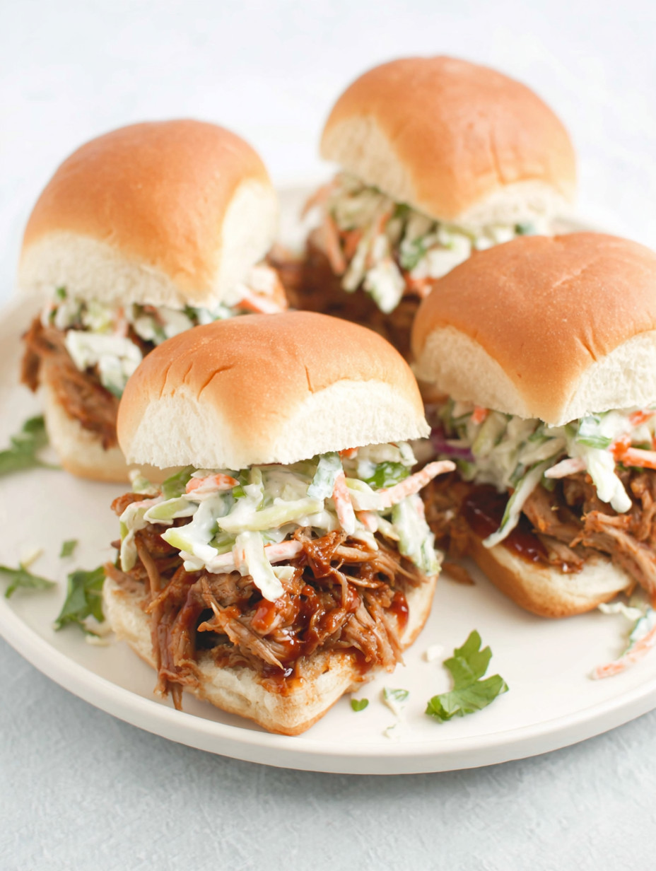 A plate of sandwiches with coleslaw.