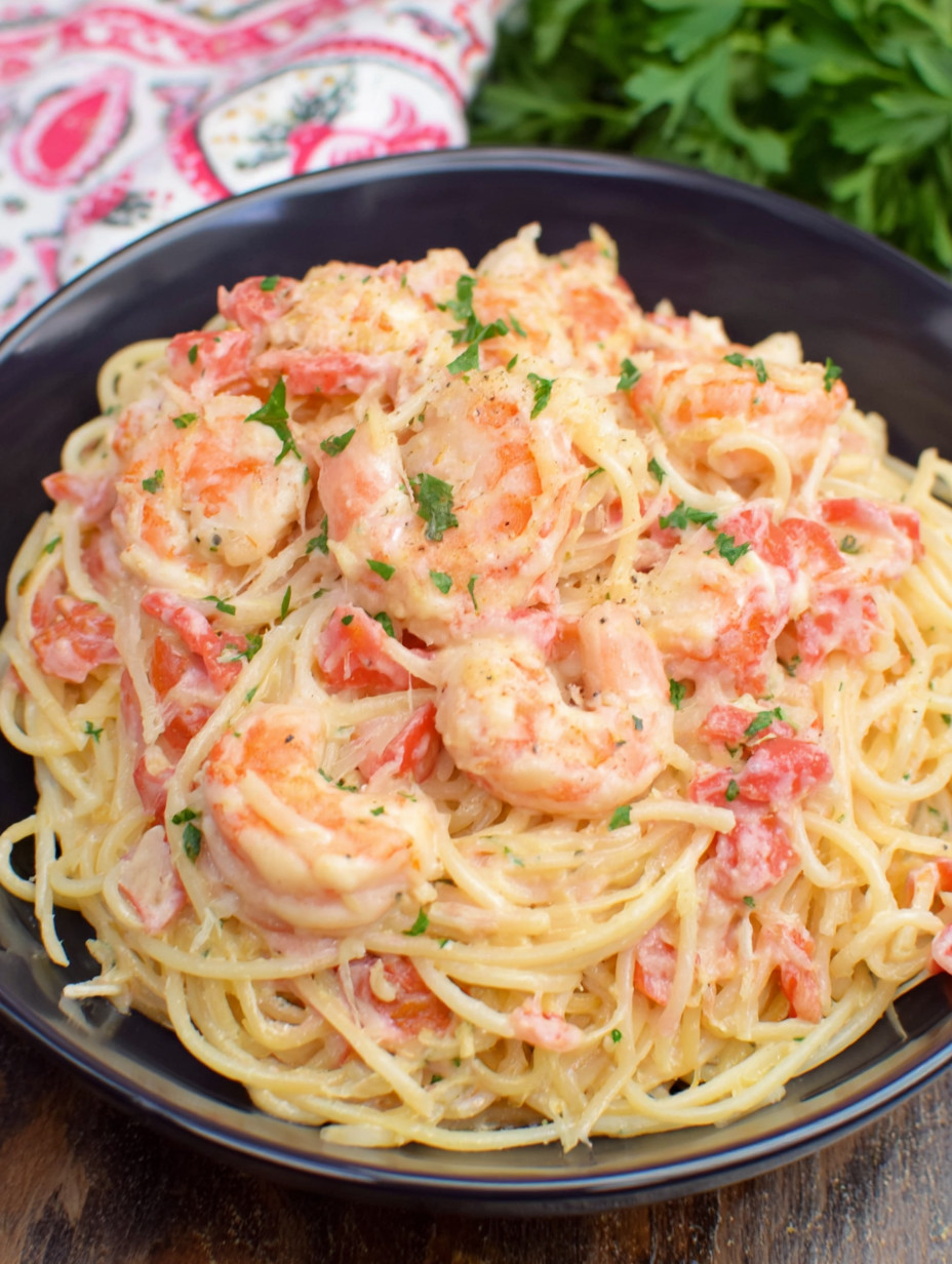 A bowl of shrimp and pasta.
