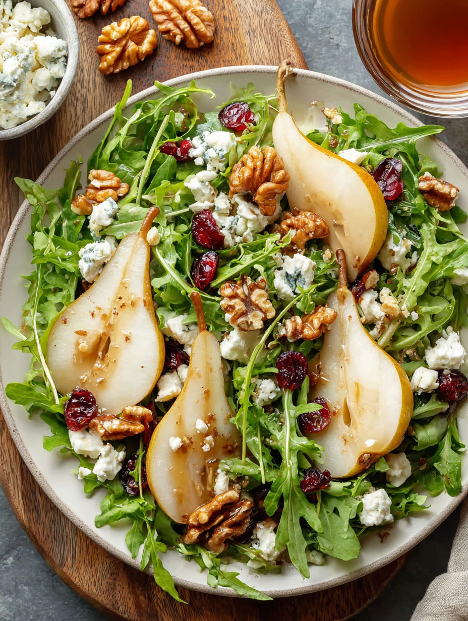 A salad with pear, walnuts, and blue cheese.