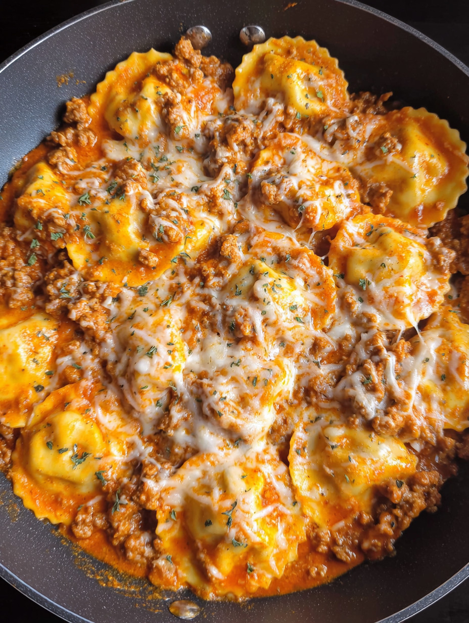A bowl of pasta with meat sauce.