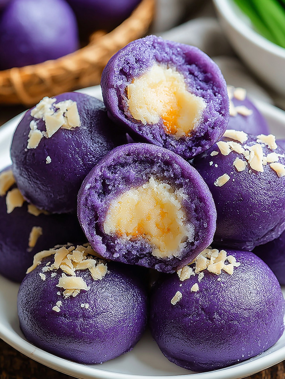 A plate of purple desserts with white topping.