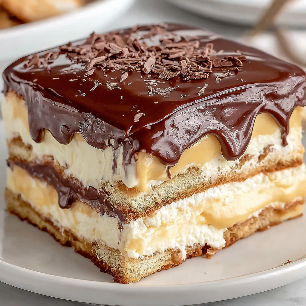 A chocolate cake with white frosting.