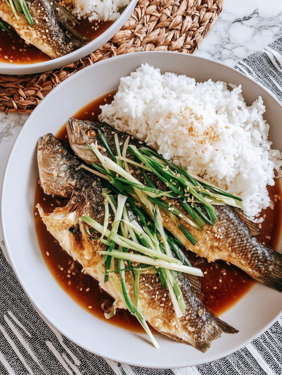 A plate of fish with rice.