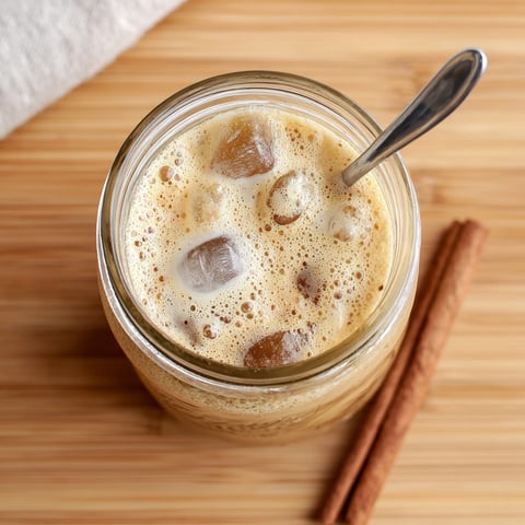 A glass of brown sugar oat milk shaken espresso.